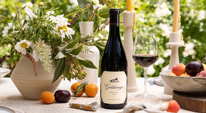 Goldeneye wines on a table with wine and fruit