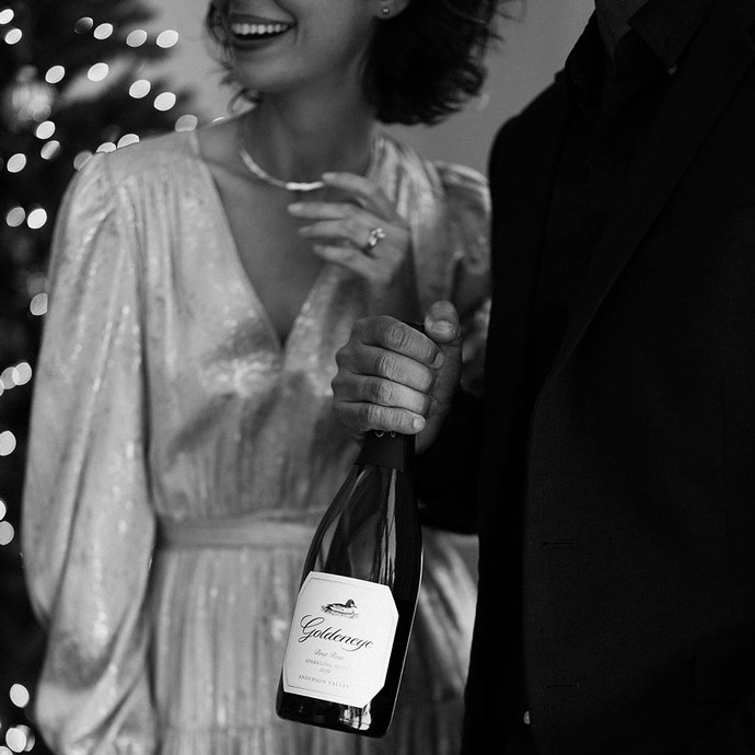 Goldeneye Brut Rosé on a tray on the bed